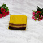 A glowing golden-yellow (mustard) body paired with a deep maroon (burgundy) border and pallu.