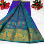 This specific garment combines a purple body with a contrasting teal green pallu and border.