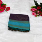 Sophisticated Bottle Green body with a delicate Pastel Pink border and pallu.