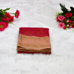Deep Red body with a soft, muted Peach-Gold border and pallu.