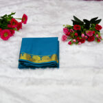 A beautiful peacock blue (teal) body that carries a rich, calming depth, paired with a bright golden border.